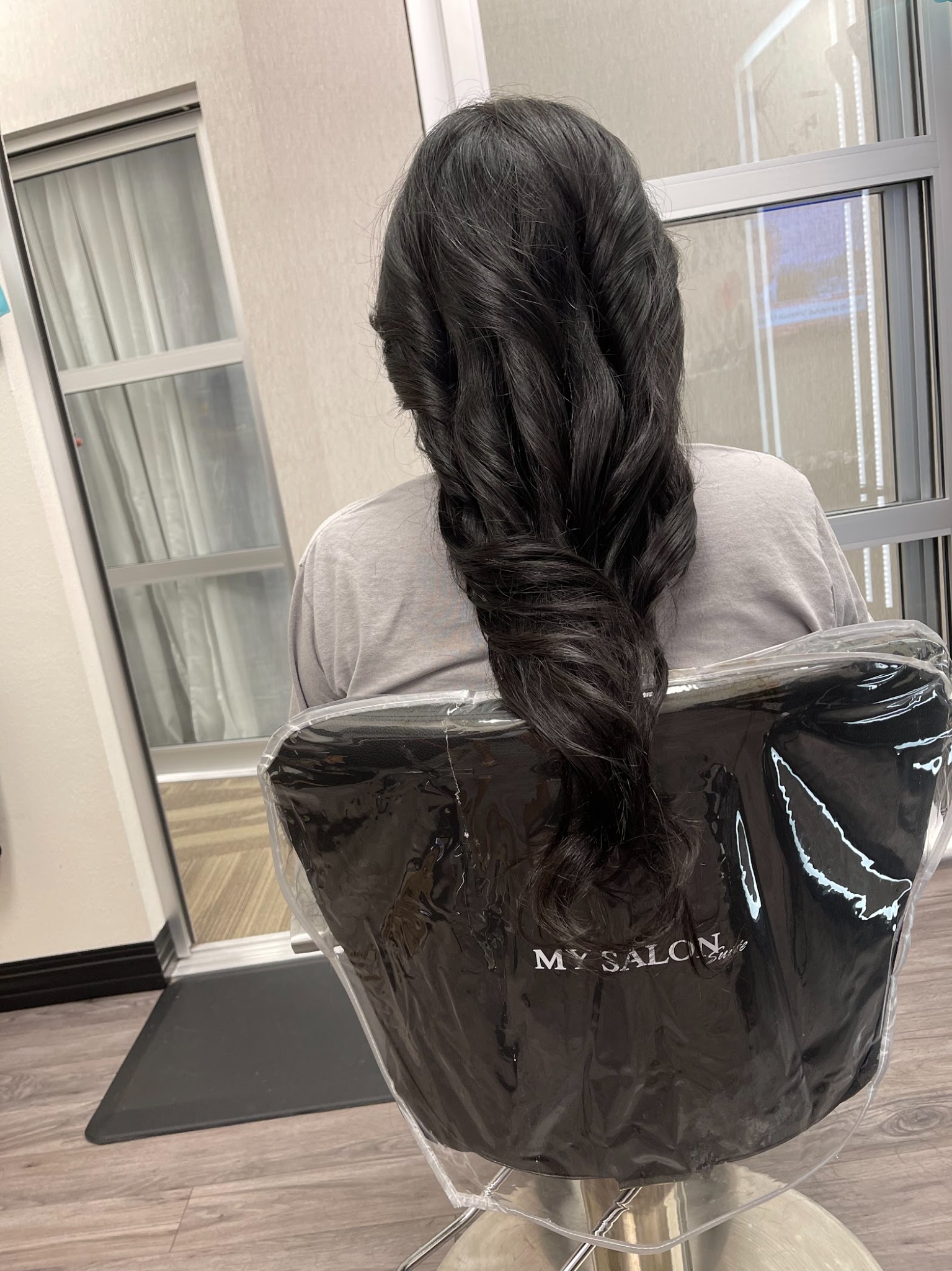 Long dark hair styled in curls